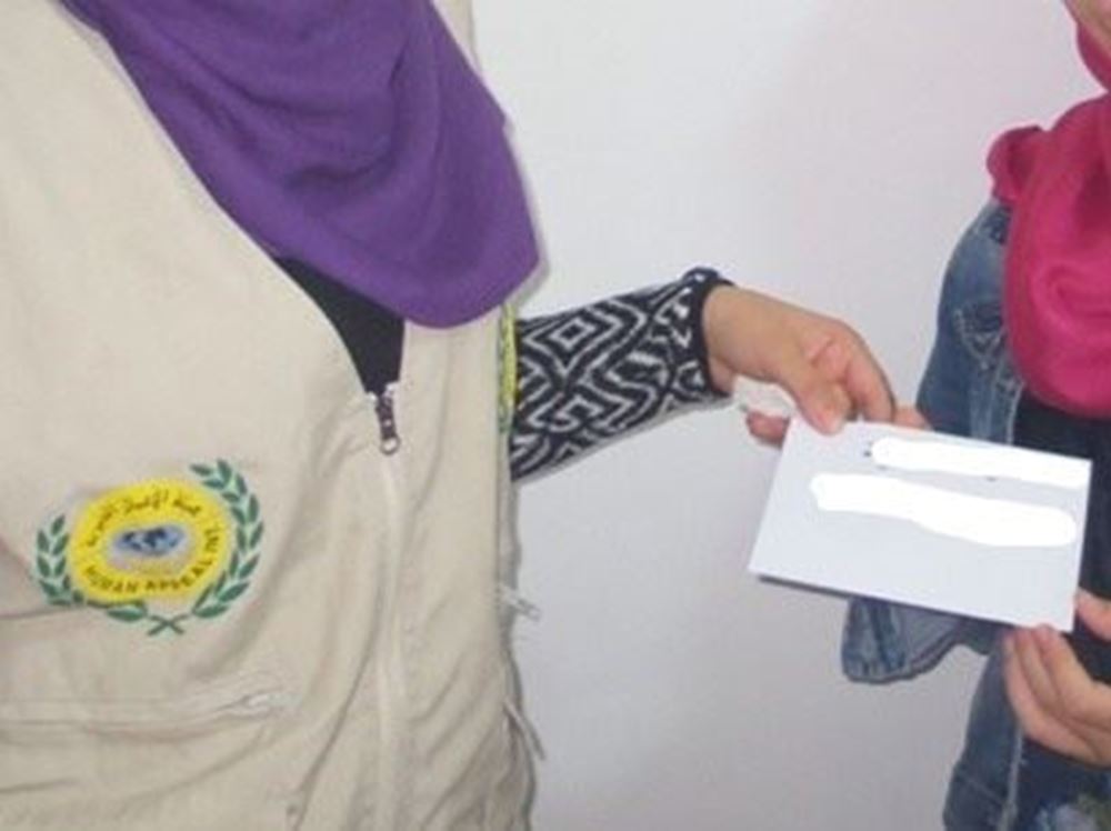 Picture of Paying the rent dues to the family of the orphan Farah - Palestine